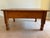 Beautiful aged antique solid wood coffee table crafted from hand-selected planks. This museum-quality piece features...