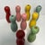 Charming vintage set of nine pastel colored tabletop bowling pins. Nine in all. Wood. Pink, pale green, yellow, pale blue...