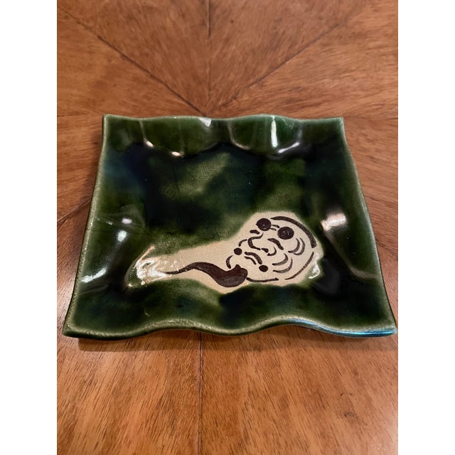 A charming set of kozara or side plates in the Oribe pallet. Deep green glaze and ruffled edges, each with a traditional...