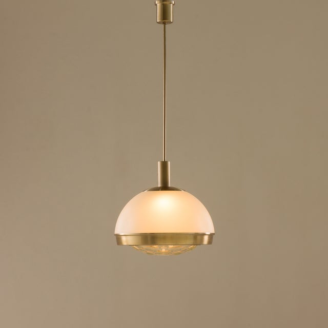 This refined italian pendant lamp designed by pia guidetti crippa for lumi, milan, dating to the turn of the 1960s and...
