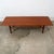 Solid teak Danish modern surfboard coffee table. The solid teak and teak veneer top surface sits upon 4 solid teak tapered...