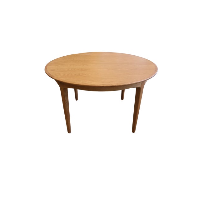 A fantastic solid oak dining table, designed by the well-known Danish designer Henning Kjærnulf and manufactured by Sorø...