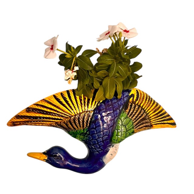 This is a whimsical, lovely bird that serves as a decorative wall art piece OR can be used as a fun way to add some color...