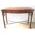 A light faux bamboo carved and mahogany serpentine console table, the crossbanded top above two paneled frieze drawers...