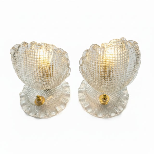 These vintage Barovier & Toso table lamps feature a sophisticated shell-shape and Murano glass craftsmanship. Dimensions:...