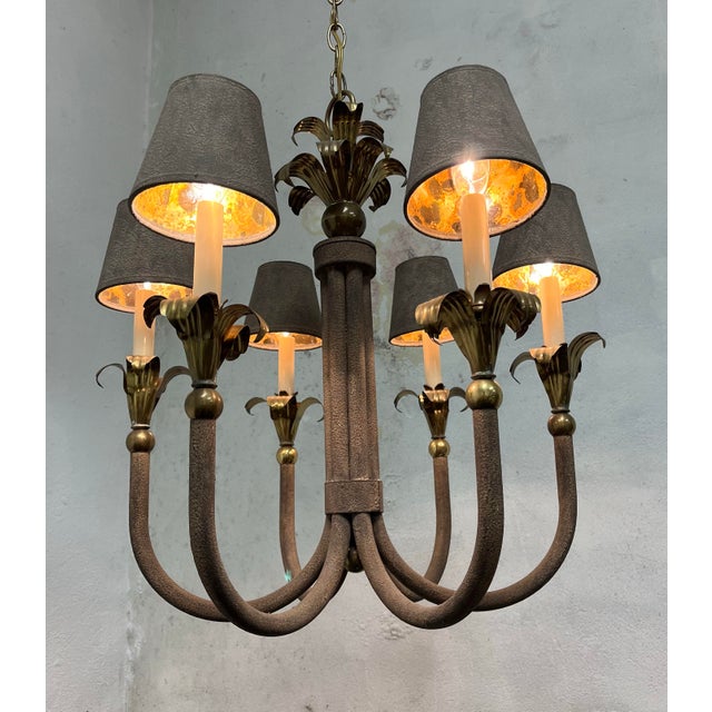 Beautiful palm frond 6 light chandelier. Textured iron with brass palm detail topped off with textured lamp shades. Great...