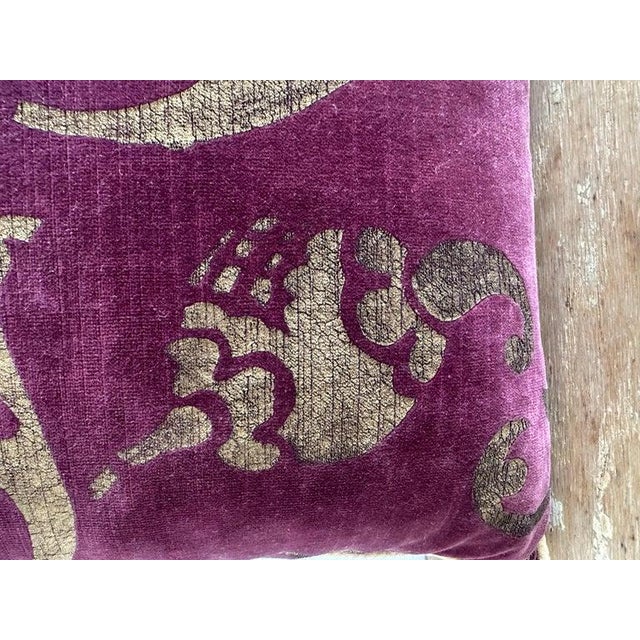 Decorative pillow crafted from an authentic Nomi Design hand-stenciled velvet, featuring an elegant scrolling motif in...
