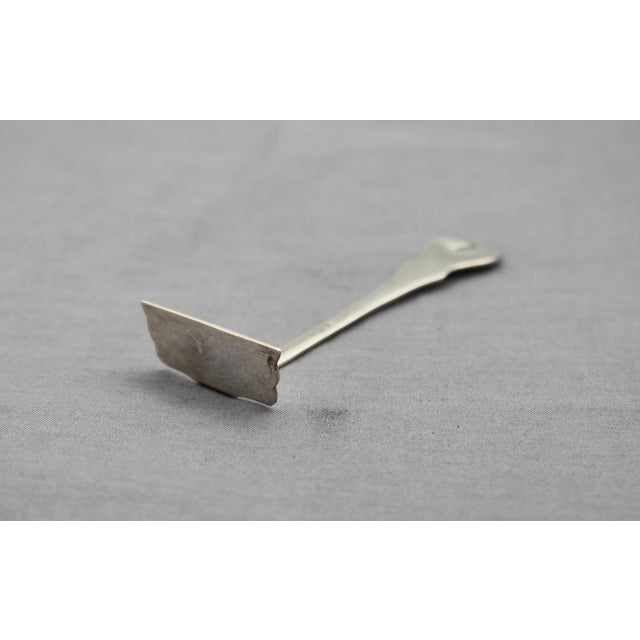 Early 20th century sterling silver food pusher by Camusso. Renowned Peruvian silversmiths. Rare Colonial Revival design....