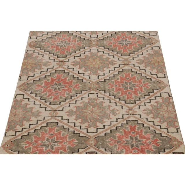 This vintage runner rug is a 3x8 Turkish distressed piece, made with hand-knotted wool circa mid-20th century. It is an...