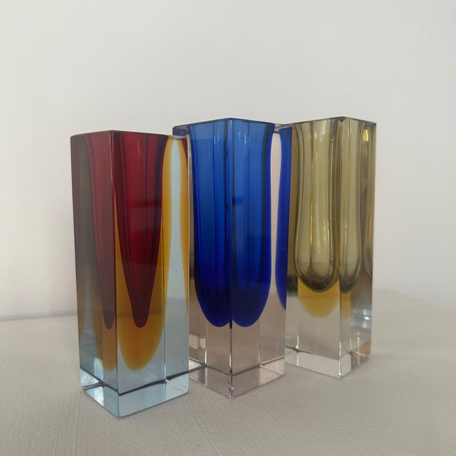 The blue vase is 14,6 x 4,6 cm, the red vase is 14 x 4,5 cm, the yellow vase is 15 x 4,5 cm, very small damage of a few...