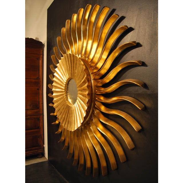 Influenced by Art Nouveau aesthetics, this exquisite mirror is entirely hand-carved from wood and finished with...
