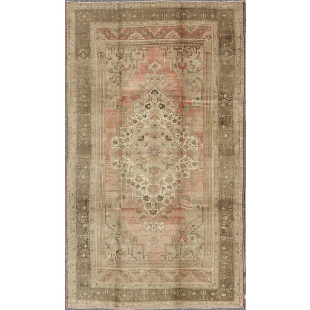 Vintage Turkish Oushak Rug With Faint Salmon Field and Floral Motifs For Sale