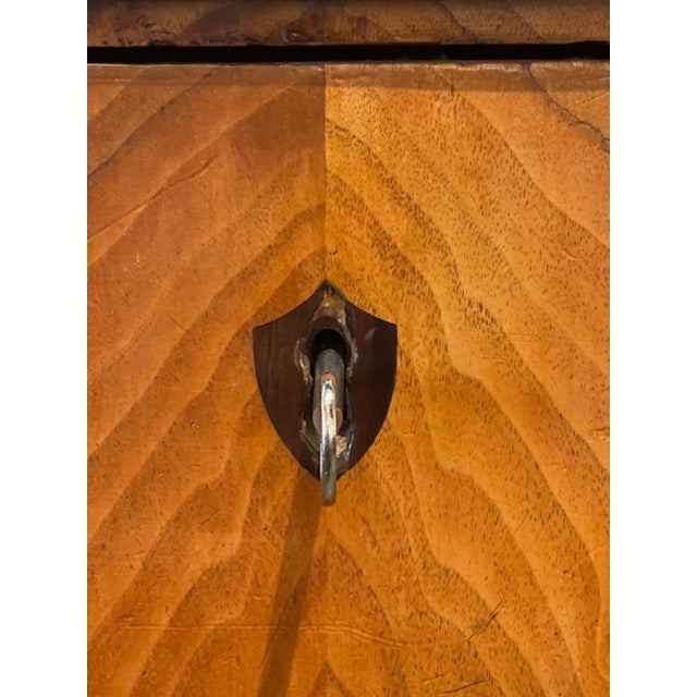 This product is a 19th century German Biedermeier walnut commode, making it a valuable antique piece for any furniture...