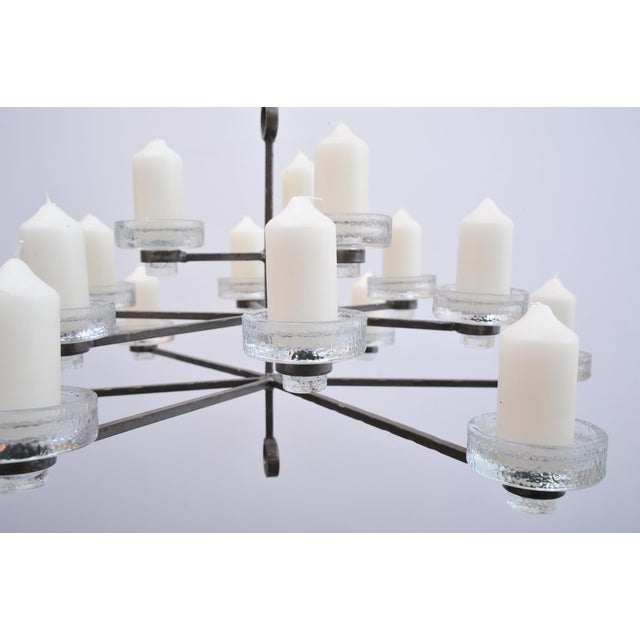 Wrought iron candlestick by Erik Hoglund with 15 glass bowls in a wrought iron frame Design: Erik Hoglund, Sweden...