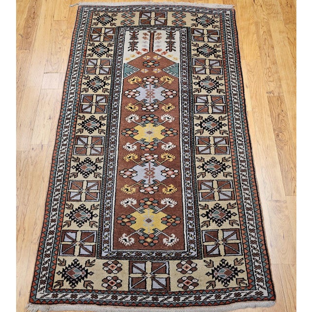 This mid-20th century Turkish prayer rug was handwoven in the renowned Melas region of Anatolia, celebrated for its...
