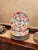 A vibrant set of vintage Arita porcelain Imari dinner plates featuring the classic Japanese floral vase panel motif in...
