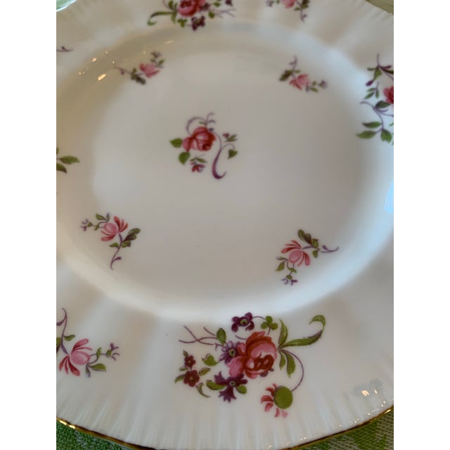 Here we have a set of eight vintage fine bone china salad or dessert plates. Made in England by Paragon in a sweet floral...