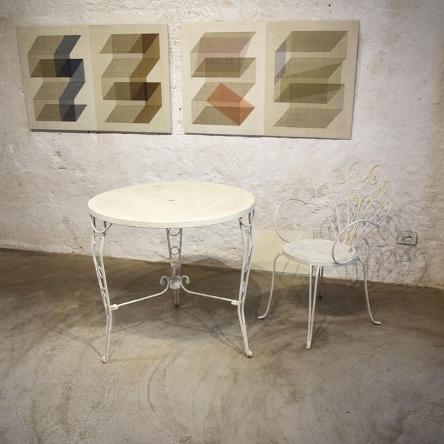 Round Garden Table in Wrought Iron, 1950s, in Good conditions. Designed 1950 to 1959 This piece is attributed to the...