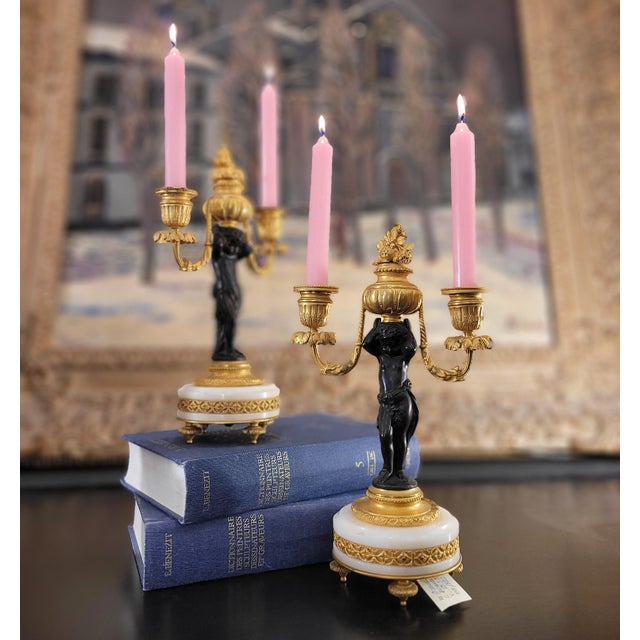 Pair of Putti Candlesticks, Bronze, Ormolu, and Marble, 19th Century – France Material: Bronze, ormolu, marble Period:...