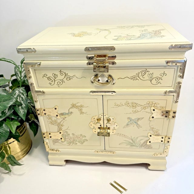 This vintage chinoiserie jewelry chest is solid wood, it's quite heavy as it weighs 18 pounds. It measures 16.5" high,...