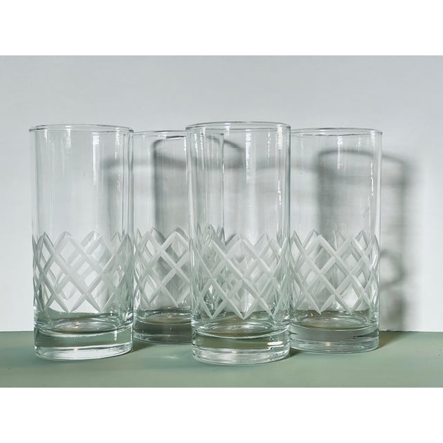 A set of four etched glass tumblers in a simple geometric pattern. Ships within 1-2 days using USPS. All items packed with...