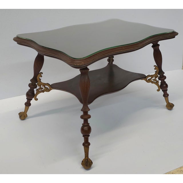 Merklen Brothers Victorian Mahogany Tiered Parlor / Library Table, Circa 1880s. Ball and Claw feet. Recently refinished....