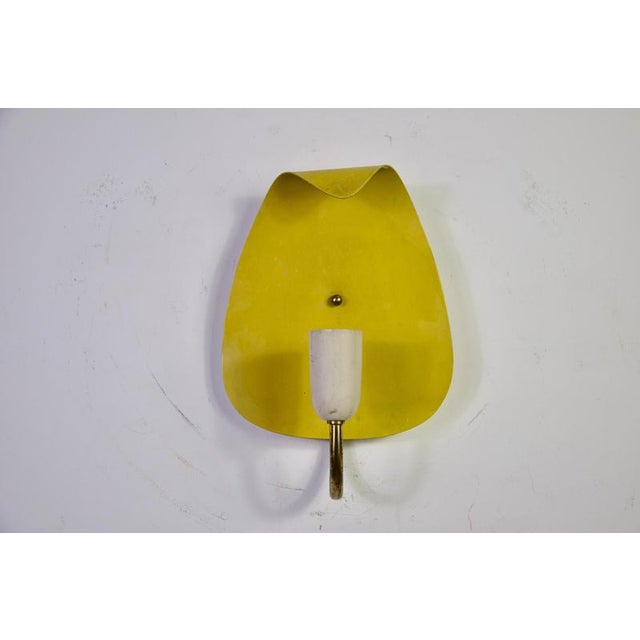 Mid-century modern sputnik wall lamp, germany, 1960s. This unusual vintage wall light features a curved brass arm with a...