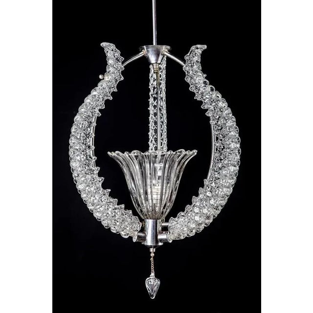 Amazing chandelier with three precious Murano glass leaves supported by a chrome frame. Up to 250V (Europe/UK...