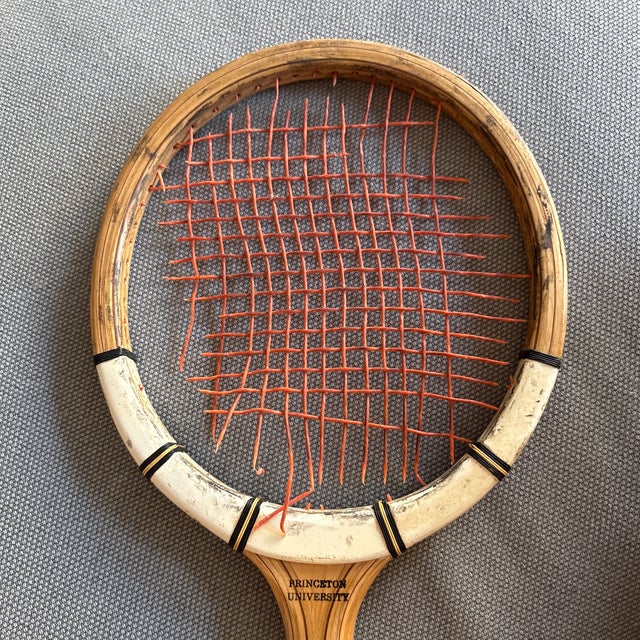 Description:A striking piece of Ivy League collegiate history, this vintage laminated wood tennis racket features the...