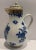 Continental blue and white lidded porcelain milk pitcher with gold details. Floral decorated, unmarked.