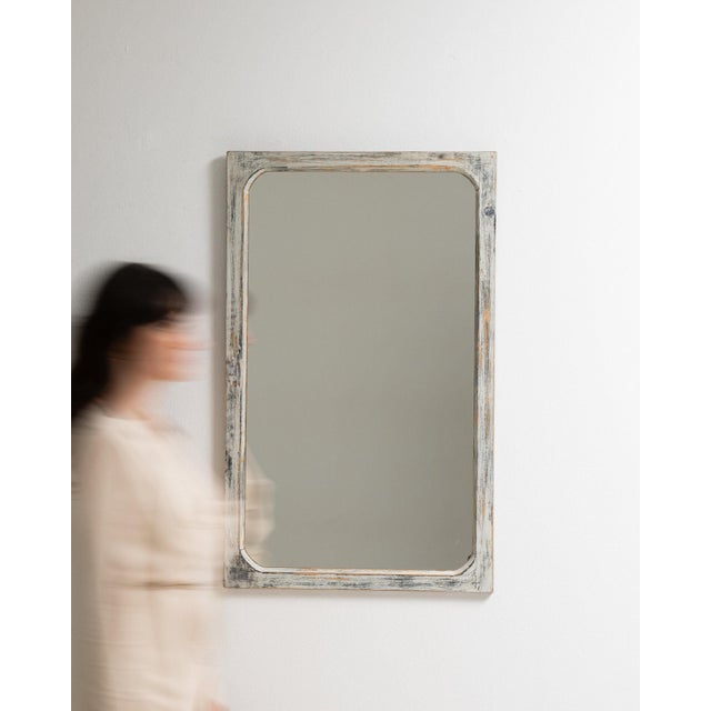This mirror makes its impression through whitewashed distressed frame, rectangular. It was made in France during 1900s, a...