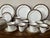 A large 55 piece set of Noritake fine china dinnerware in the Gold And Sable pattern with gold rimmed and black sable...