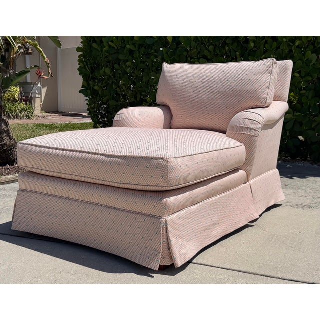 Vintage Baker Furniture Milling Road chaise lounge chair featuring an English-style rolled arm, loose seat cushion,...