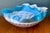 This striking art glass bowl is a masterful example of the Murano glassblowing tradition, featuring a fluid, wavy rim that...