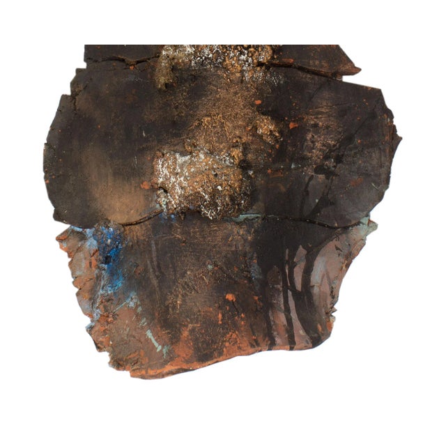 A 1990 mixed media wall sculpture titled Misty Blue Current III by American artist Juliet Holland (1937-2017). Composed of...