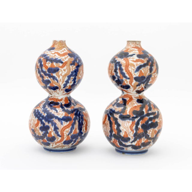Pair of Japanese Imari Porcelain Double Gourd Form Vases, 19th century, each hand-painted with phoenixes and with cobalt...