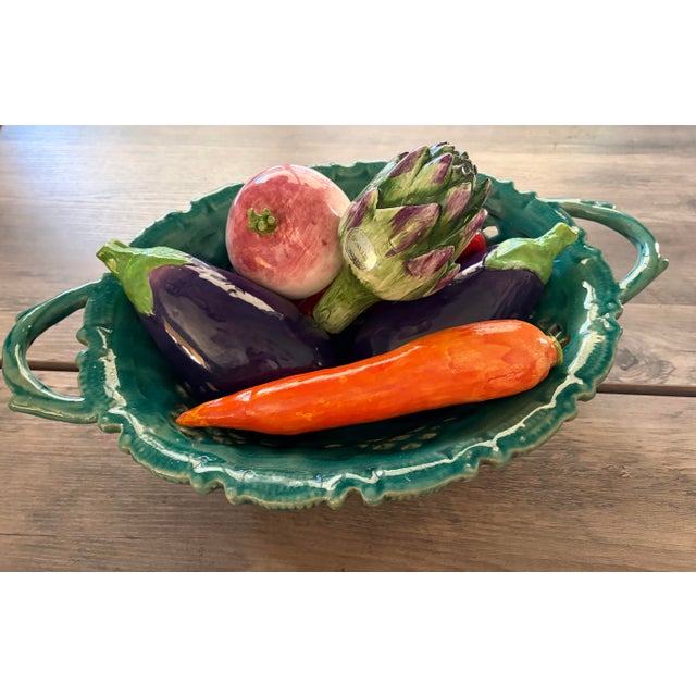 The Vintage Italian Majolica Style Trompe L'oeil Vegetable Basket Centerpiece is a feast for the eyes—playful, richly...