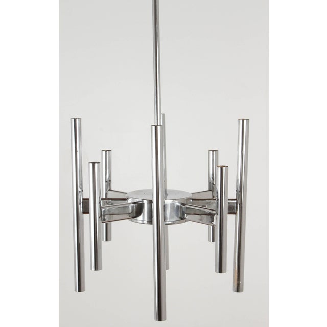 Sciolari eight-arm chandelier, circa 1970. Lights face downward.