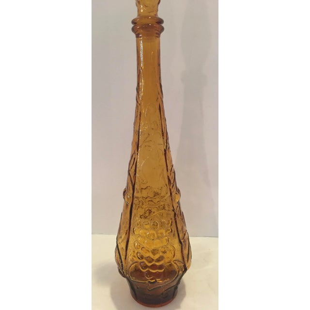 Pristine Mid Century Modern Empoli amber genie art glass bottle. Circa 1960’s Made in the USA ! Measures 5” x 5” x 22.5”...