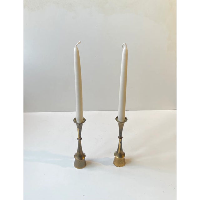 A pair of solid brass candlesticks designed and manufactured by jens harald quistgaard - ihq in denmark during the 1960s....