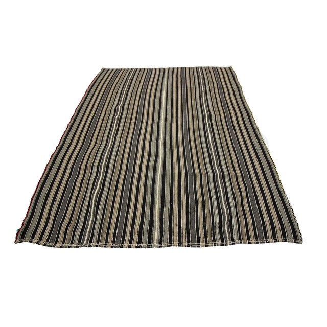 Handwoven striped vintage kilim rug from Afyon region of Turkey. Approximately 45-55 years old. In very good condition