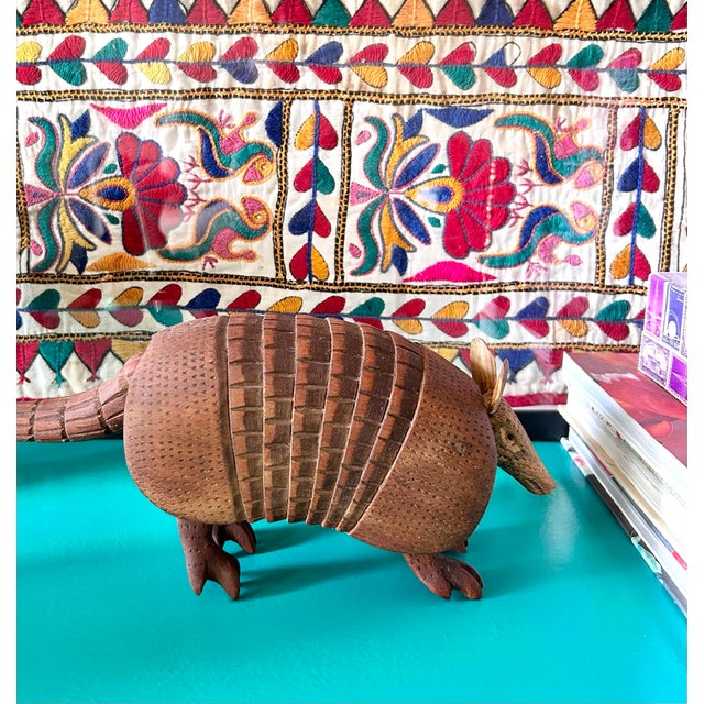 Vintage hand-carved wooden armadillo sculpture featuring a beautifully detailed segmented accordion body and rich textural...