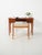 Elegant Scandinavian mahogany desk from the 1940s and 1950s with four drawers and brass handles, featuring a light and...