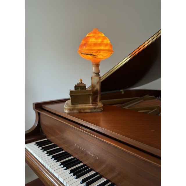 A beautiful antique boudoir/table lamp in the Art Deco style, featuring a genuine carved alabaster "beehive" shade that...