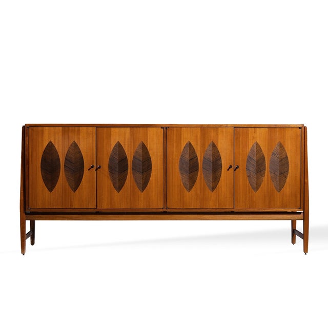 Kipp Stewart for Calvin Furniture Mid Century Walnut and Rosewood Sideboard Credenza This credenza measures: 66.75 wide x...