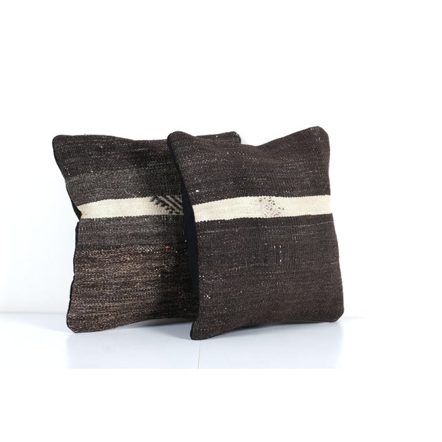 Turkish Brown and Black Kilim Pillow Cover – Set of Two Elevate your home decor with these exquisite 15" x 15" pillow...