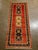 Vintage Hand-knotted Persian Kashkoli wool runner featuring a red field with three vertically aligned medallion panels,...