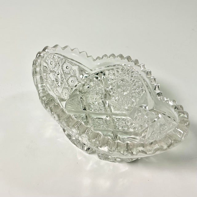 Between 1876 to 1916 American glass producers hand cut glass with sawtooth edging that became known as American Brilliant...