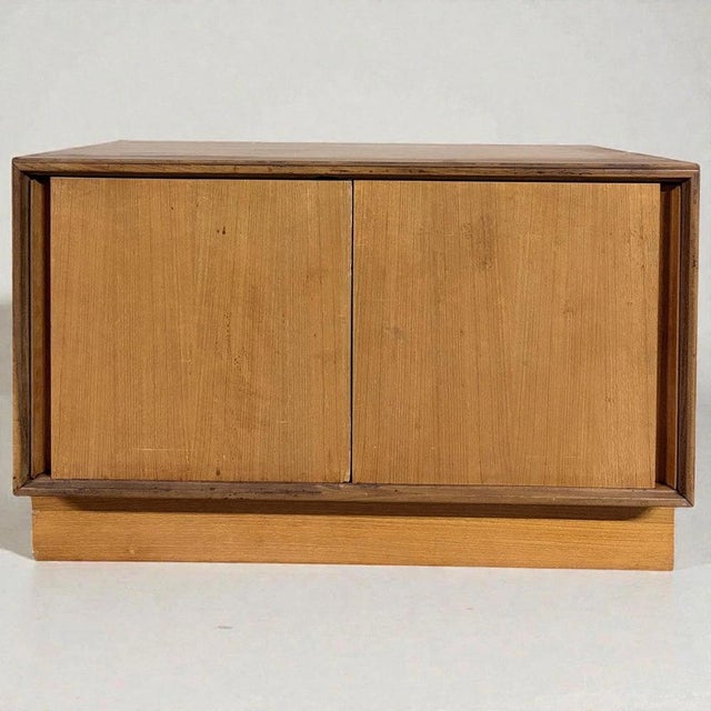 The g plan sliding door cabinet is a mid-century storage cabinet crafted from teak veneer, designed to offer a compact...
