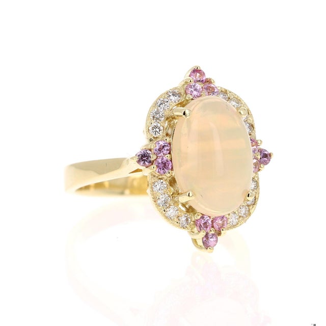 2.91 Carat Oval Cut Opal Diamond 18 Karat Yellow Gold Ring The Oval Cut Opal in this ring weighs 2.30 Carats and the...
